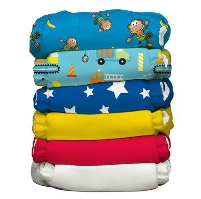 Reusable Newborn Nappies and Organic Cotton Covers in vibrant colors and playful designs for eco-friendly diapering.