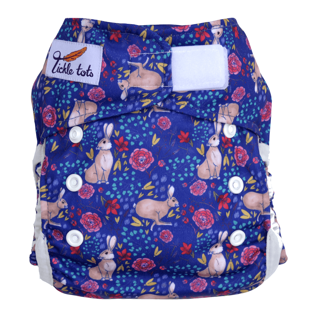 Reusable Two Piece Nappies and Baby Essentials with a hare print design in blue and floral patterns.