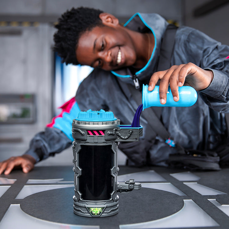 A child experimenting with the MrBeast Lab Mutators Chamber - Iconic Panther, pouring liquid into the action figure chamber.