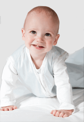 Smiling baby wearing Joey Swag Baby Sleeping Bag, showcasing comfort and safety for restful sleep.