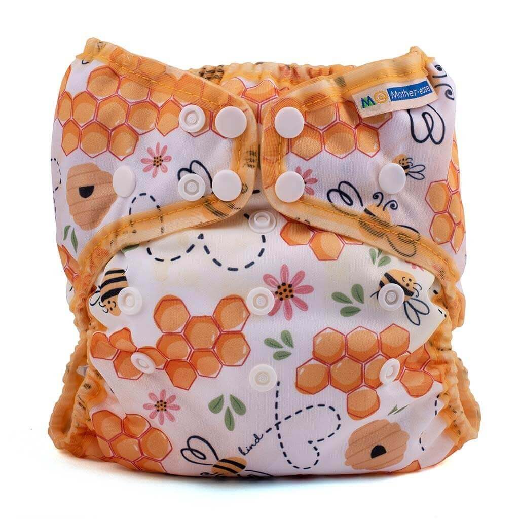 Wizard Uno Stay Dry Cloth Nappy - Newborn with honeycomb and bee pattern design, featuring snap buttons for easy use.