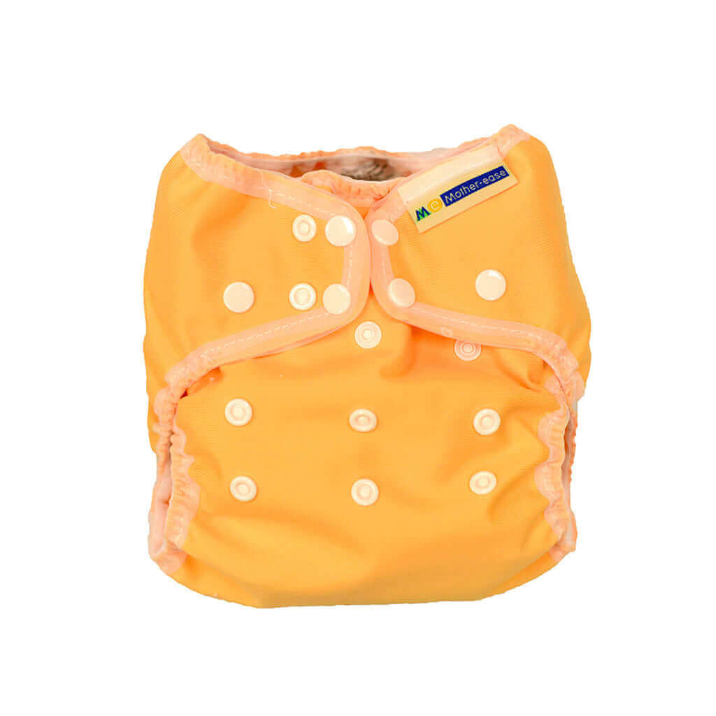 Wizard Uno Stay Dry Cloth Nappy in bright orange color, featuring adjustable snaps for a secure fit.