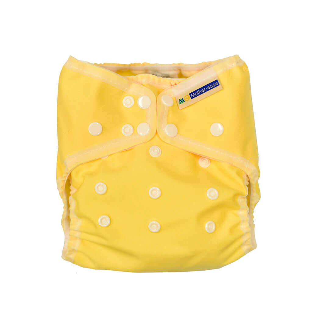 Wizard Uno Stay Dry Cloth Nappy in bright yellow color with adjustable snaps for newborns.