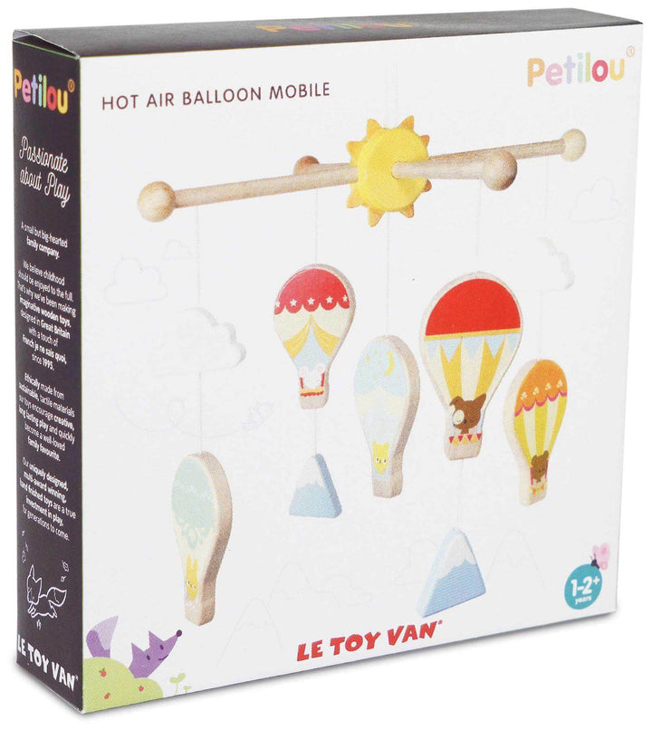 Petilou Wooden Hot Air Balloon Baby Mobile with bright clouds and mountains for nursery decor.